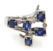 18ct white gold ring set with sapphires and diamonds stamped 750 Condition Report