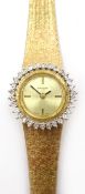Baylor Swiss 9ct gold bracelet wristwatch, diamond set bezel 25.