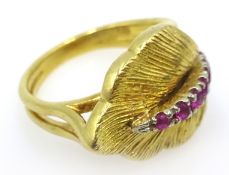18ct gold ring in the form of a leaf set with rubies approx 6.
