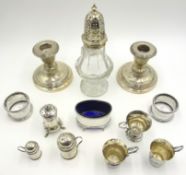 Silver and cut glass sugar sifter, pair dwarf candlesticks, condiments,