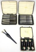 Two sets of six of Art Deco silver handled tea knives with stainless blades,