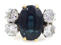 18ct gold ring set with central sapphire and four diamonds stamped 18ct plat Condition