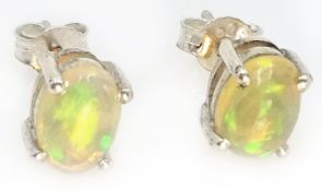 Pair of natural opal silver stud ear-rings stamped 925 Condition Report Each opal 0.