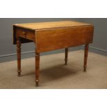 Early 20th century mahogany Pembroke drop leaf table, single drawer, turned supports on brass cups,