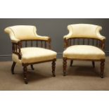 Pair Edwardian walnut tub shaped armchairs, turned gallery back upholstered in damask fabric,