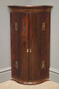 19th/20th century rosewood serpentine front wall hanging corner cabinet, projecting cornice,
