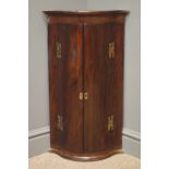 19th/20th century rosewood serpentine front wall hanging corner cabinet, projecting cornice,