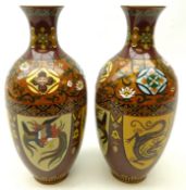 Pair of Chinese Cloisonne vases, each of baluster form, decorated with panels of dragons and birds,