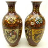 Pair of Chinese Cloisonne vases, each of baluster form, decorated with panels of dragons and birds,