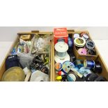 Quantity of fishing tackle including; large number of spools of fishing line, fishing reels,