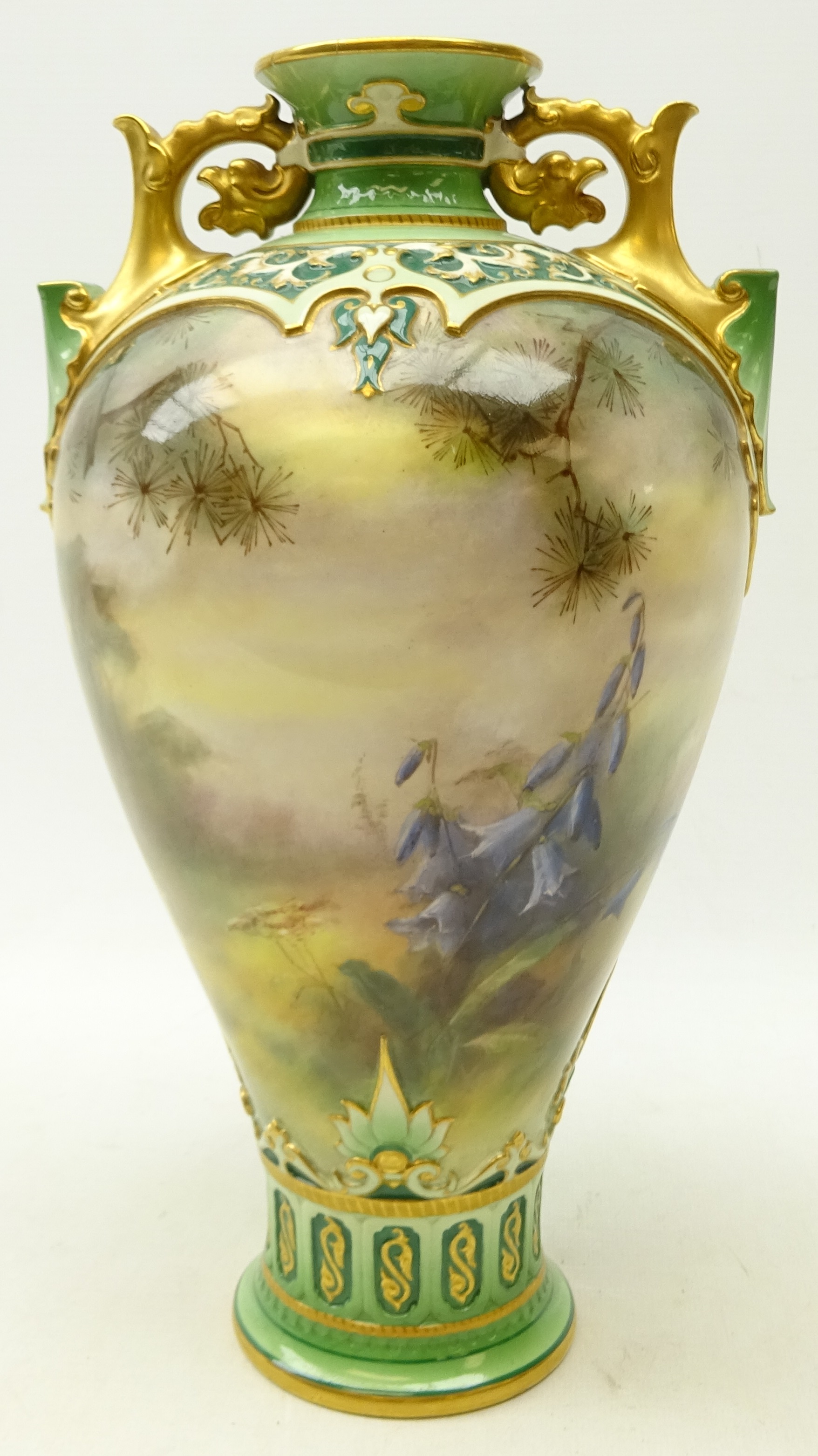 Hadley's Worcester vase, of baluster form with two pierced gilt handles,