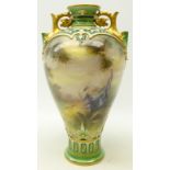 Hadley's Worcester vase, of baluster form with two pierced gilt handles,