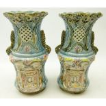 Pair of Victorian blue glazed, two handled vases with moulded, pierced and painted decoration,