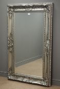 Rectangular bevel edged mirror in silvered swept framed,