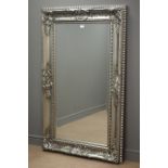 Rectangular bevel edged mirror in silvered swept framed,