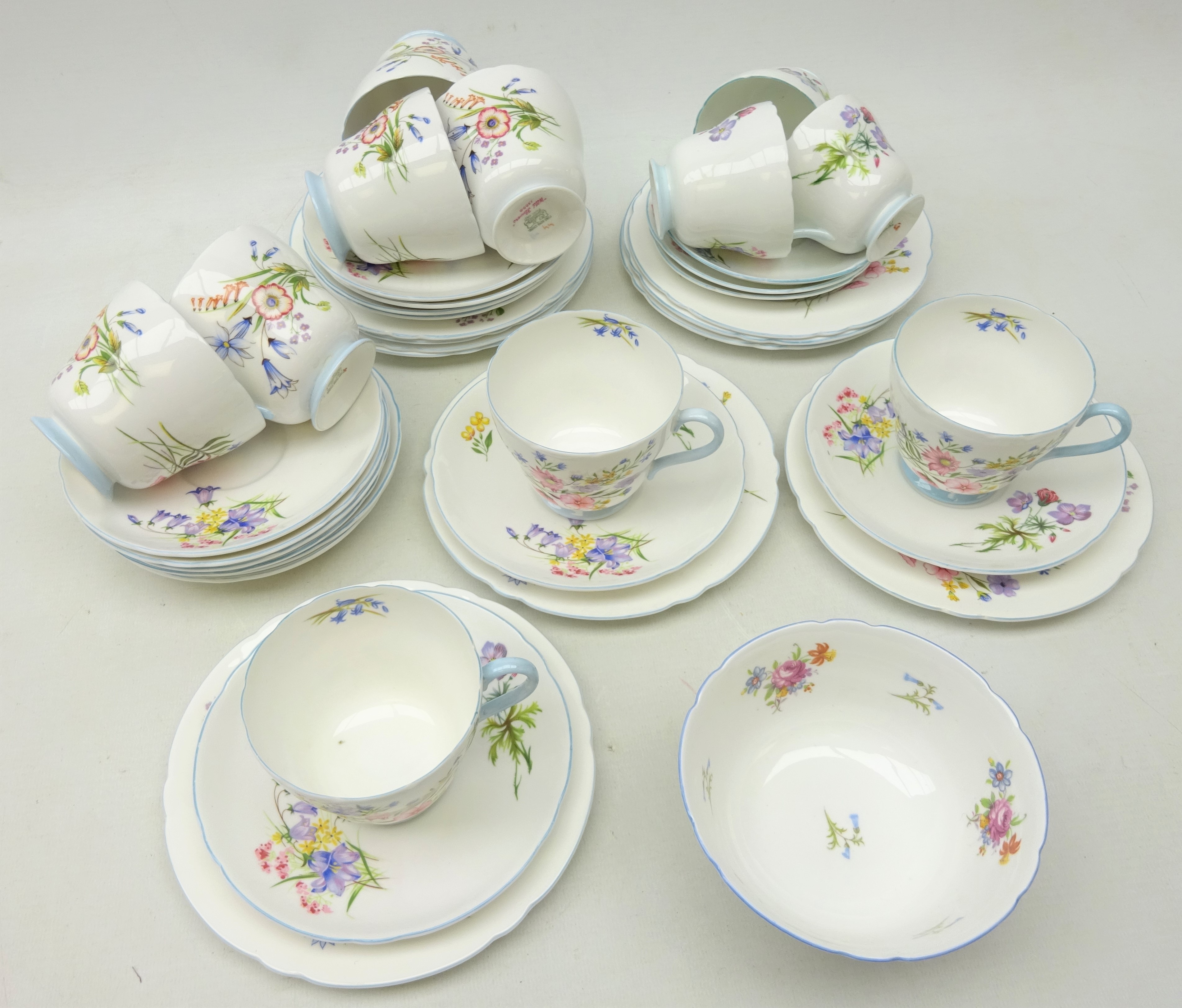 Eight Shelley 'Wild Flowers' pattern trios, three coffee cups and saucers, sugar bowl etc, No.