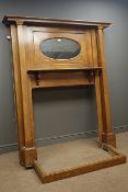 Arts & Craft period oak fire surround, projecting cornice, inset oval mirror, above shelf,