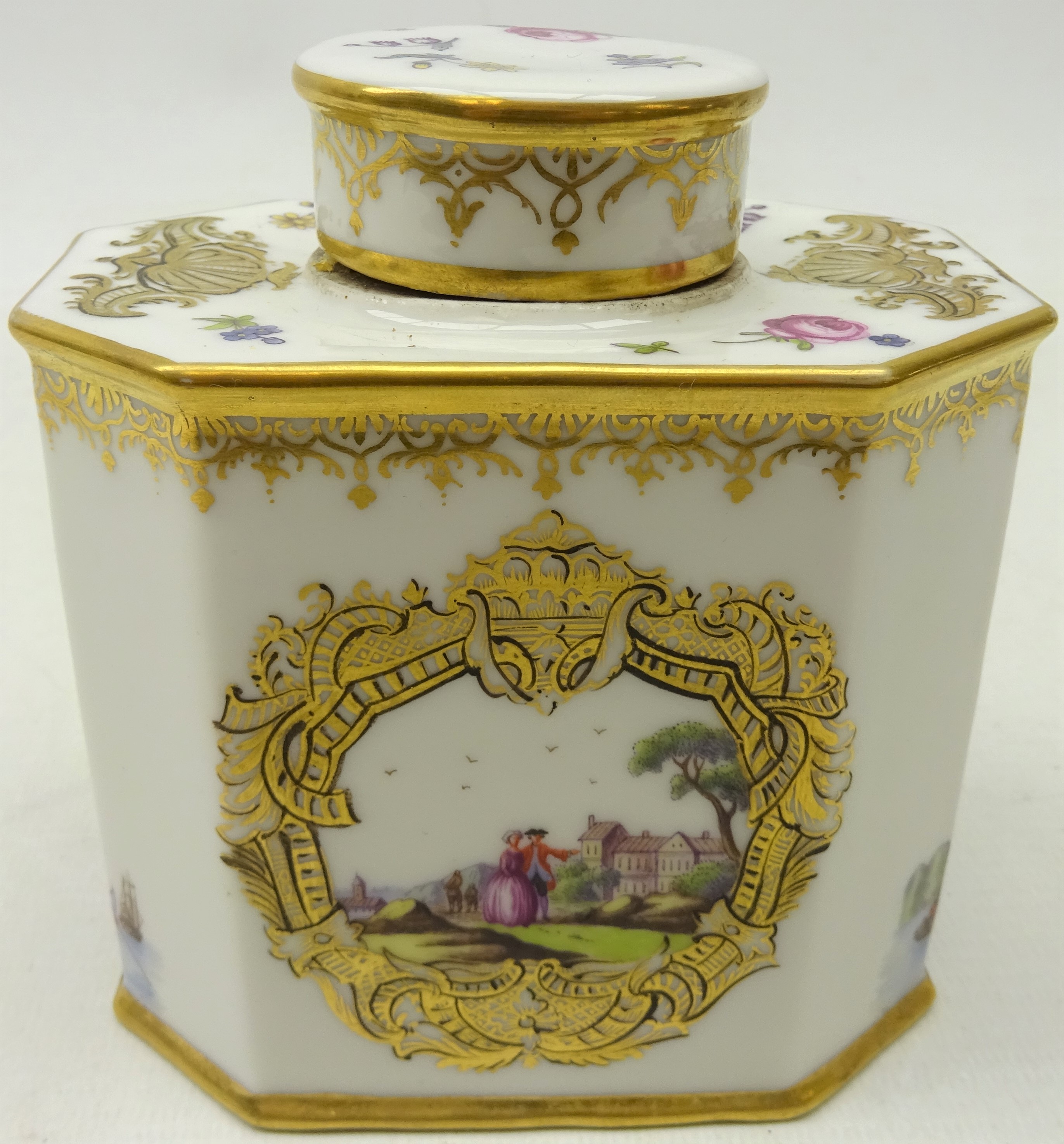 20th century Continental porcelain tea canister decorated with painted two vignettes of a couple in