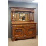 Edwardian walnut sideboard raised bevel edged mirror back, projecting cornice,