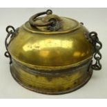 Eastern brass food warmer, possibly Tibetan, of circular form with domed lid and chain hinges,