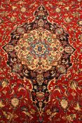 Persian Meshed red ground rug carpet, pointed medallion with rosette,