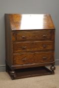 Early 20th century oak bureau, fall front enclosing fitted interior with leather inset,