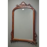 Mahogany framed bevel edged wall mirror, carved foliate pediment and brackets, W79cm,