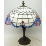 Tiffany style table lamp with leaded glass shade and moulded cast metal base,