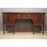 Early 20th century mahogany serpentine sideboard, fitted with centre drawer and two cupboards,
