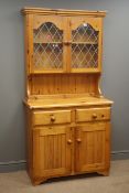 Pine farmhouse dresser, raised lead glazed display cabinets, two drawers and panelled cupboard,