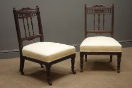 Pair Edwardian walnut framed nursing chairs, carved cresting rails, upholstered seats,