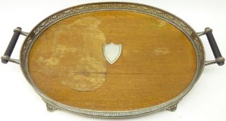 Edwardian oval gallery tray with oak base and silver-plated pierced sides,