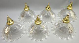 Set of six early 20th century Holophane hanging light fittings with reeded clear glass shades and