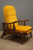 Early 20th century oak reclining armchair, upholstered in mustard velvet, raising arm rests,