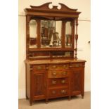 Edwardian walnut sideboard, shaped and carved pediment, two turned and fluted columns,