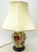 Moorcroft 'Pirouette Breeze' table lamp of baluster form on plinth with shade,