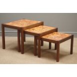 1970s floral patterned tile top teak nest of three tables, W60cm, H47cm,