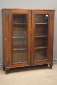 Early 20th century mahogany bookcase, acanthus carved sides, two glazed doors, four shelves,