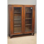 Early 20th century mahogany bookcase, acanthus carved sides, two glazed doors, four shelves,