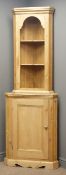 20th century waxed pine corner cabinet, two shaped shelves above single panelled door, W68cm,