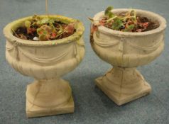Pair composite circular stone urns classical style mouldings, square base, D36cm,