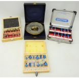 Three cased sets of router blades and an cased brass aneroid Barometer (4) Condition