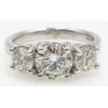 Three stone round brilliant cut diamond, white gold ring hallmarked 18ct,