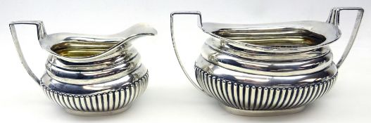 Silver milk jug and sugar basin of ribbed baluster design by James Deakin & Sons Sheffield 1923,