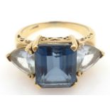 Three stone blue and pale topaz gold ring, hallmarked 9ct Condition Report Approx 6.