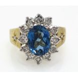 9ct gold oval blue topaz and diamond cluster ring hallmarked Condition Report size