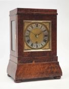 20th century amboyna library clock, stepped case with shaped plinth, on turned bun feet,