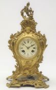 Early 20th century French gilt metal cartouche mantel clock, circular Roman dial,