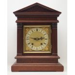 Late 19th century walnut bracket clock, in architectural case with carved frieze,