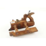 A handled beech screwstem plough by JAMES REID Glasgow with skate front and boxwood stems and nuts